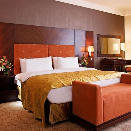 Amt Mena Aparthotel Доха Стая снимка